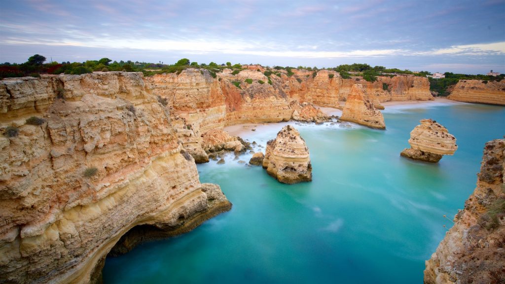 a rocky cliffs and blue water